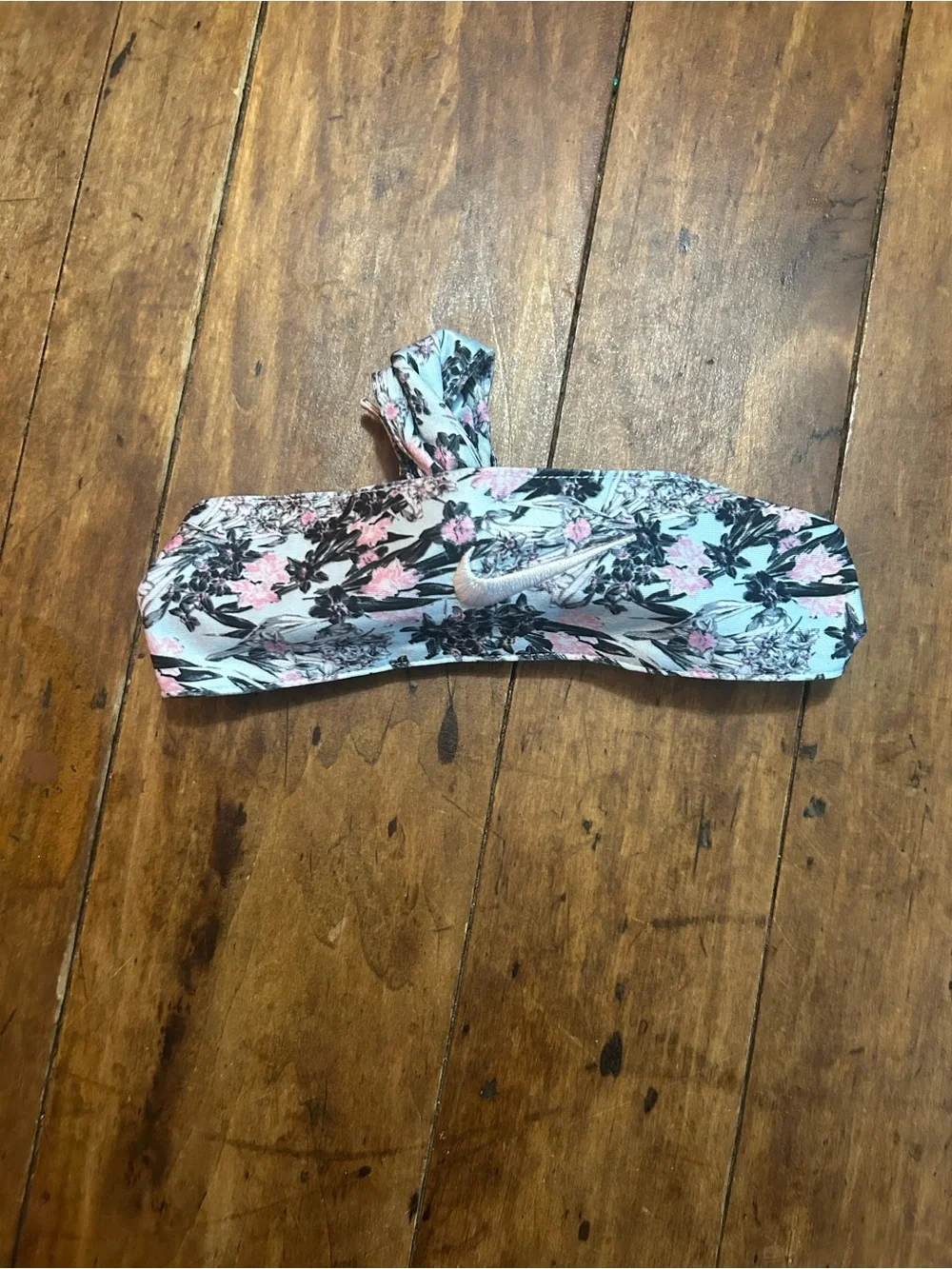 1 Floral blue pink and black Nike headband and 1 orange white and green headband